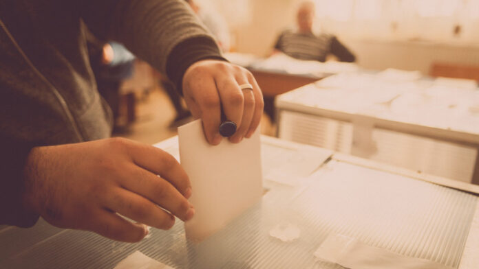 Person voting at polling station